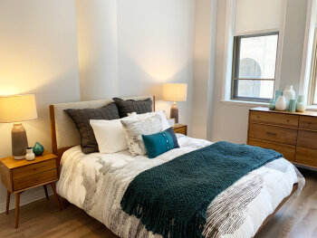 Bedroom of an apartment at Liberty Lofts at Sibley Square in Rochester, NY.