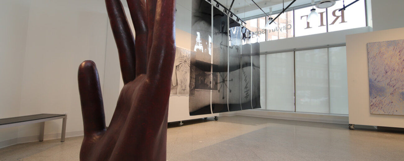 Hand sculpture and other displays at RIT City Art Space.